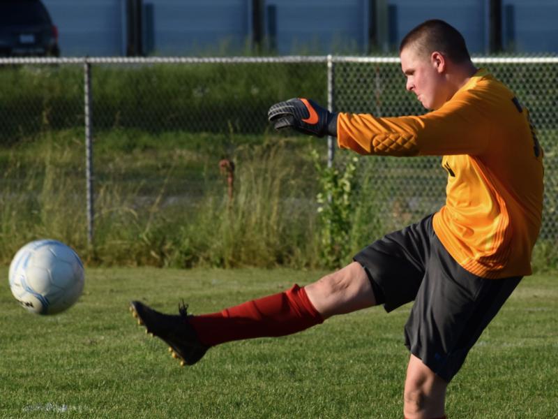Goal keeper LJ Travis clears the ball away in the third quarter. PHIL DI VECE/Wiscasset Newspaper