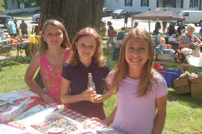 Vivian Mckinney, Corinne Joyce and Raegan Eddy make jewelry with beads. ART MAYERS/Wiscasset Newspaper