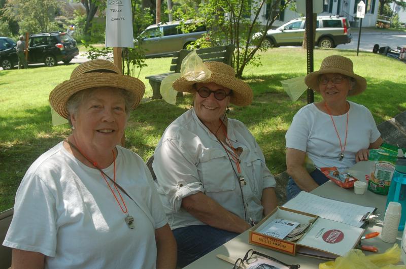 From left, the Poopettes, Joni Leigh, Deborah Morgan and Gretchen Burleigh Johnson register dogs for the parade. ART MAYERS/Wiscasset Newspaper