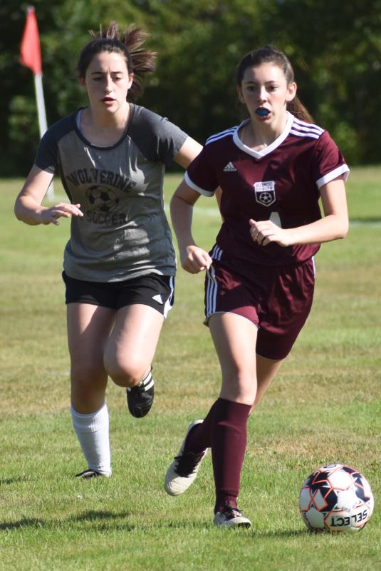 Kayla Cossette pursues a Richmond player. PHIL DI VECE/Wiscasset Newspaper