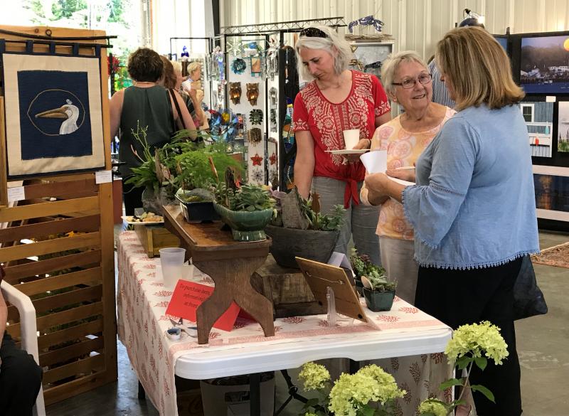 The opening reception of the Arts & Yachts Exhibition and Sale. KELLIE BIGOS/Boothbay Register