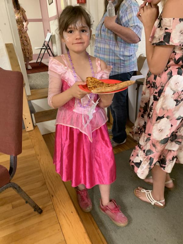 Olivia McKitrick, 7, joins other princesses for a pizza break in the festival. SUSAN JOHNS/Wiscasset Newspaper