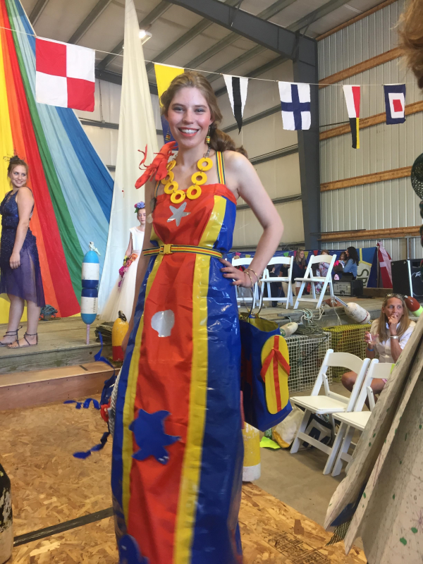 Natalia Gosselin looks stylish in the original design of Deb Lewis and Martha Barker. Blue shrink wrap from Blake Marine and yellow shrink wrap tape connects to orange life preserver material. Belt and earrings are designed from life preserver straps. The hat is a tow rope with fishing tackle and coral sponges. File photo