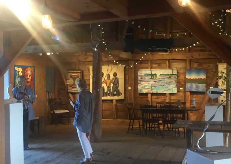 Priscilla Alden says goodbye to a St. Louis visitor who read about the show back in Illinois and planned to see it on her trip to Maine. LISA KRISTOFF/Boothbay Register