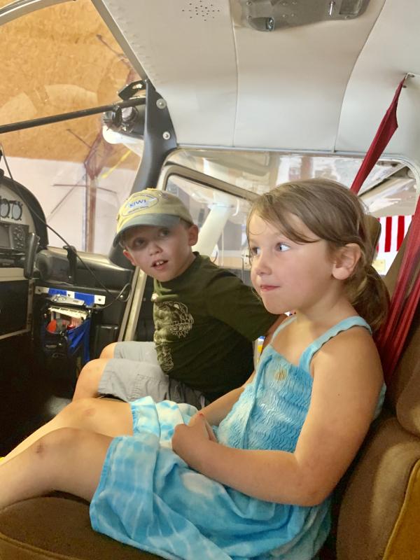 Visiting Wiscasset Municipal Airport on Labor Day, Sept. 2, Alna siblings Eben Robinson, 7, and Savannah Robinson, 4, check out the inside of a Cessna 185 float plane. SUSAN JOHNS/Wiscasset Newspaper