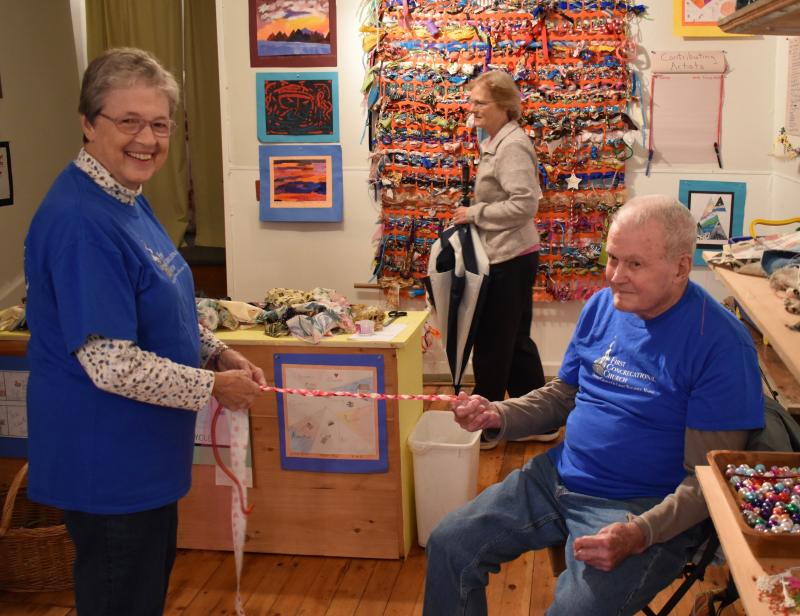 Nancy and Wally Roby braid a string for the community tapestry. PHIL DI VECE/Wiscasset Newspaper