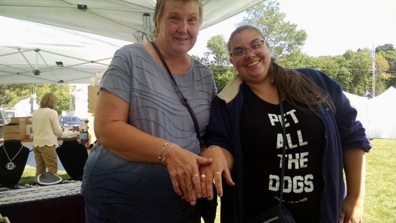 Lyn Johnson, left, of Lebanon, Connecticut, and Heather Thompson, right, of Boothbay show off the new rings they bought from Karrottop Jewelry. MARGARET HOFFMAN/Boothbay Register Karrottop Jewelry, Boothbay Common, Craft Show
