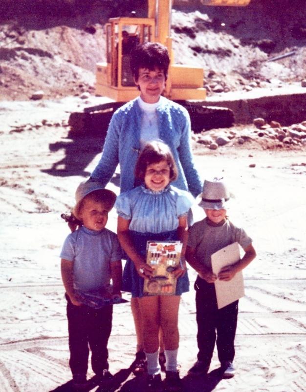 Jeanette Shaw, pictured here with her grandchildren, Tammy and the twins, Jason, left, and Stacey. Jack is operating the excavator. Courtesy Jack Shaw & Sons, Inc.
