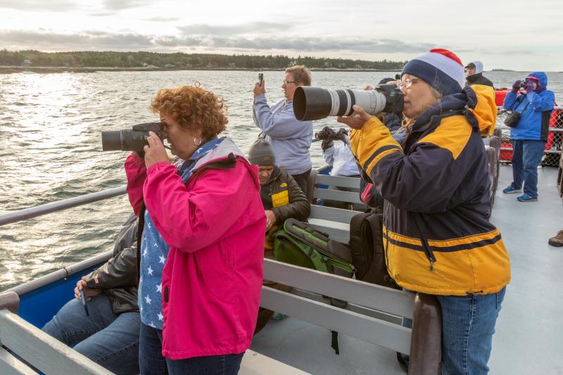 Sunrise Photography Cruise participants take aim. Mike Leonard photo