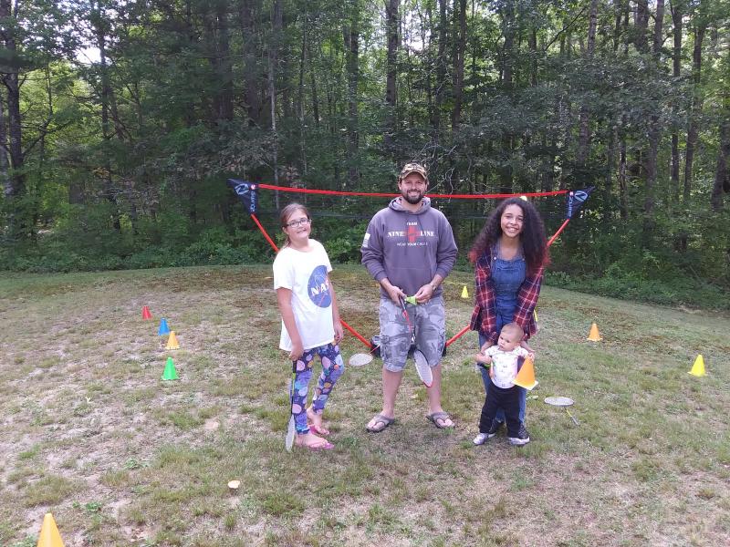 Members of the Sherlock family stand by for badminton. From left are Bella, Joe, Imij Armstead and toddler Maya. JANE CARPENTER/ Boothbay Register