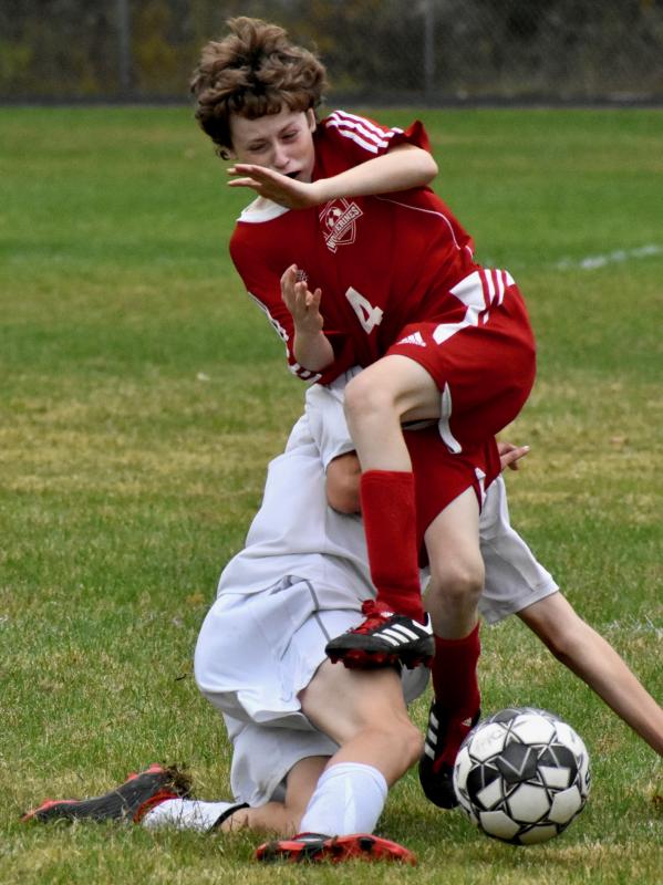 Wolverine Karter Cooper collides with a Spruce Mountain player late in the first half of play. PHIL DI VECE/Wiscasset Newspaper