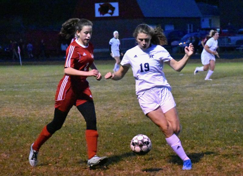 Wolverine Eliza Paradis and Telstar’s Dylan Duclos. PHIL DI VECE/Wiscasset Newspaper