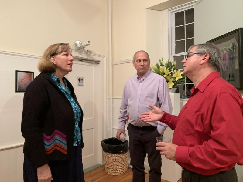 Peter Davis, center, and Tommy Davis meet with an attendee on opening night Oct. 5. SUSAN JOHNS/ Wiscasset Newspaper