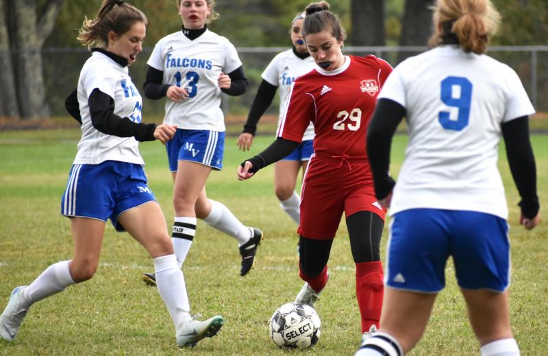 Paige Davenport finds herself surrounded by Falcons in the opening minutes of the second half. PHIL DI VECE/Wiscasset Newspaper