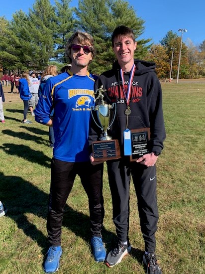 Coach Nick Scott and athlete Will Perkins celebrate the Seahawks-Wolverines’ big win and their awards for coach of the year and runner of the year. Courtesy Photo