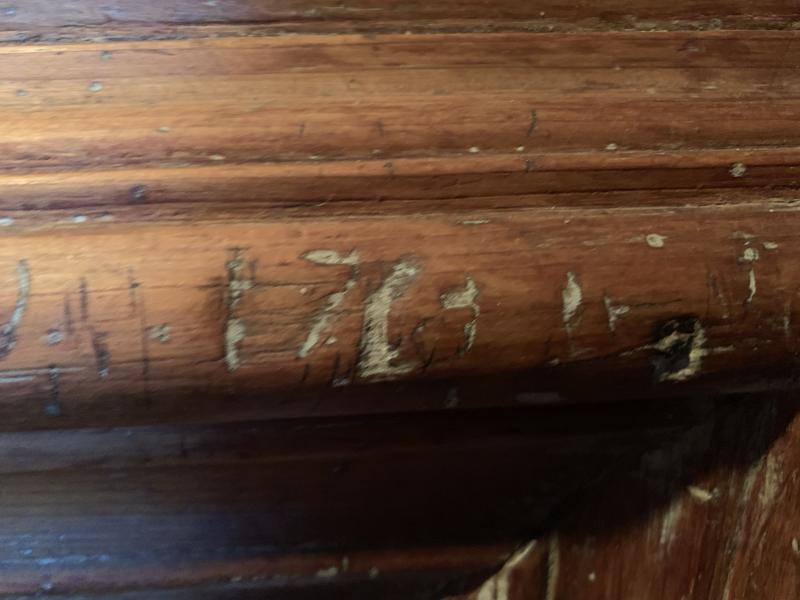 William Dykes believes the home’s first owner, William Groves, carved “1763” on this fireplace. Dykes said the carving turned up under several layers of paint. SUSAN JOHNS/Wiscasset Newspaper