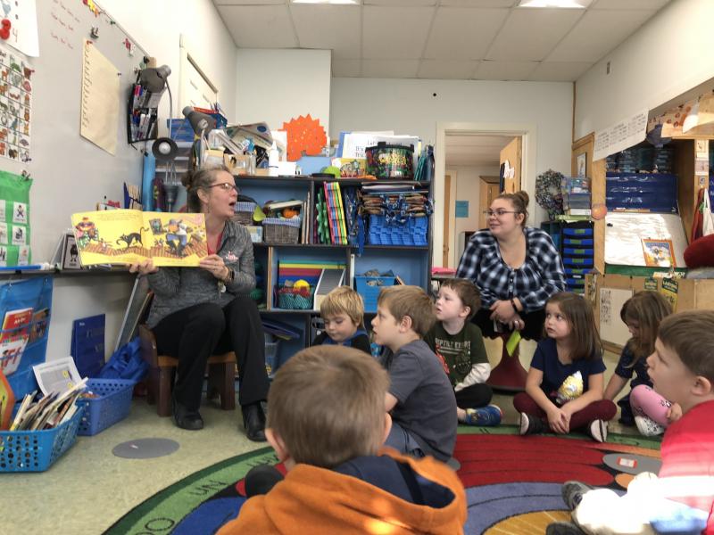 Pre-K teacher Amy Mitchell shares an interactive book with her class. Cindy Collamore photo