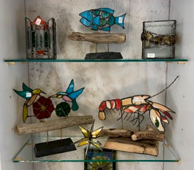Here’s but a sampling of Dick Macdonald’s stained glass holiday gift ideas in this year’s Gifts For Giving held at Studio 53 in Boothbay Harbor. Courtesy of Sanny Norton