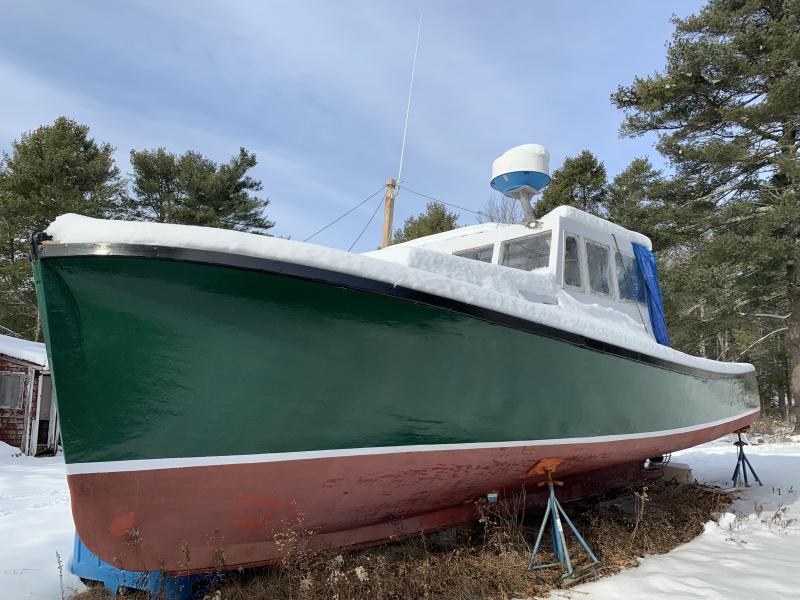 A boat keeps snow off part of a yard opposite Wiscasset Municipal Airport on Chewonki Neck Road Jan. 23. SUSAN JOHNS/Wiscasset Newspaper