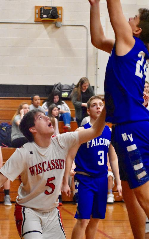 Billy Pinkham can’t stop Falcon Cooper Davis. Also shown Mountain Valley’s Kalen Chase. PHIL DI VECE/Wiscasset Newspaper