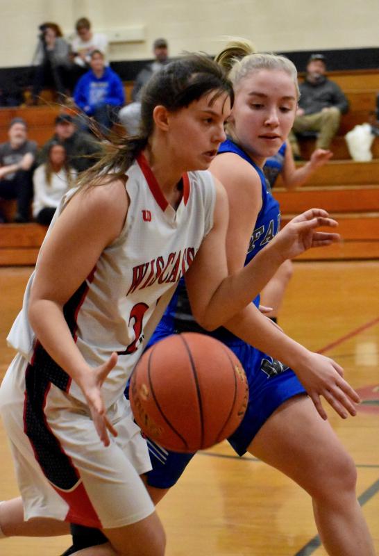 Kailee Colby, guarded closely, brings the ball down the court against Mountain Valley. PHIL DI VECE/Wiscasset Newspaper