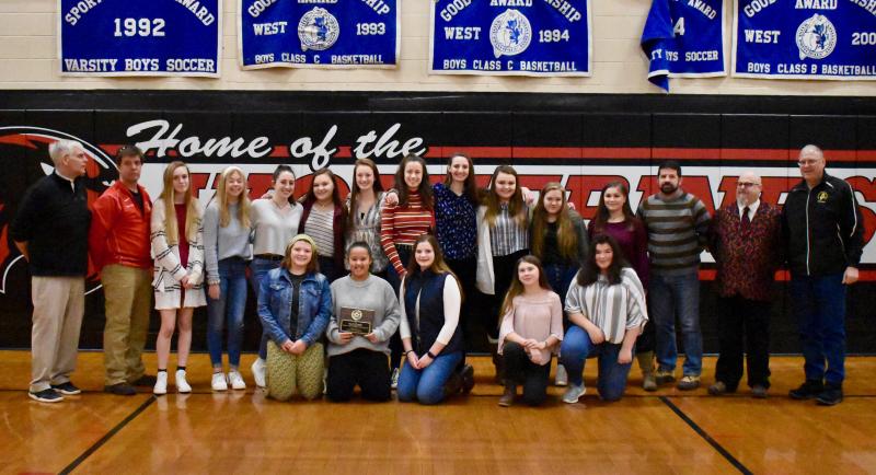 Todd Underwood, far right, representing the Midcoast Board of Approved Soccer Officials, presents the group’s 2019 Willy Walter Sportsmanship Award to Wiscasset Middle High School’s Wolverine girls’ varsity soccer team Jan. 18. At left are WMHS Athletic Director Warren Cossette and Wolverine Coach Duane Goud. Third and second from far right are Assistant Coach Todd Souza and Assistant AD Bob Applebee. Players, from left, are Zoe Waltz, Kaitlyn Main, Kayla Cossette, Jade Rego, Gwen Webber, Eliza Paradis, Kylie Peoples, Jasmine Rego, Kateleen Trask and Angie Haggett. And kneeling: Lily Souza, Latisha Wright, Carolyn Potter, Brianna Colson-Orr and D’Nisha Dawkins. PHIL DI VECE/Wiscasset Newspaper