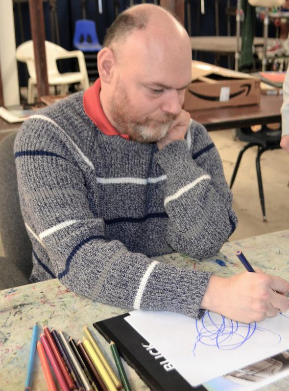 Lester Warman works on his next picture " What the man said” at Creative Expressions art group. See his work in the “Art From the Heart” show at Miles. Eleanor Busby photo