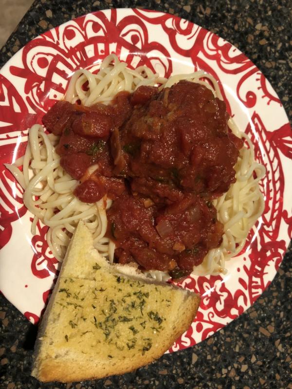 Tuscan meatballs with marinara sauce and spaghetti and a slice of garlic bread. Lisa Orne Hallinan photo