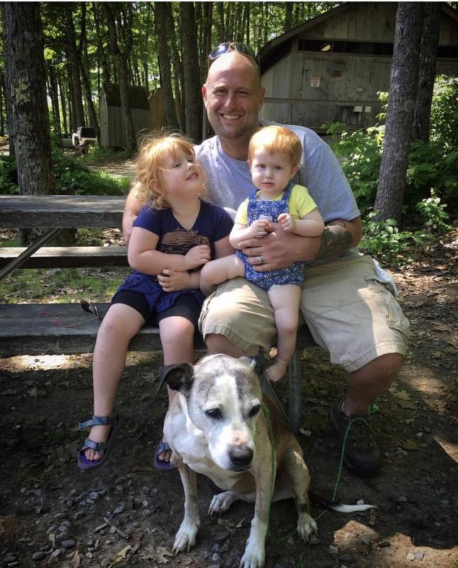 Chris holding his girls. Courtesy of Jessica Pinkham