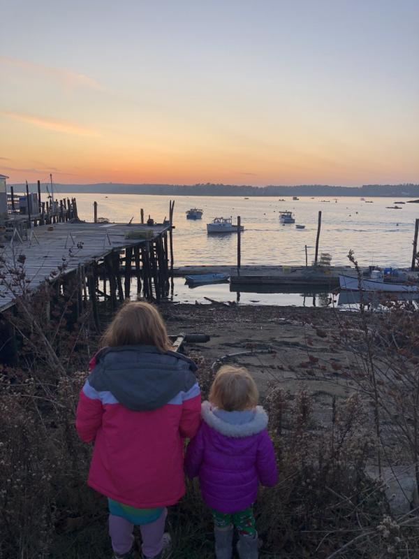 Dorothy and Cedelia watching their Dad bring the boat in. Courtesy of Jessica Pinkham