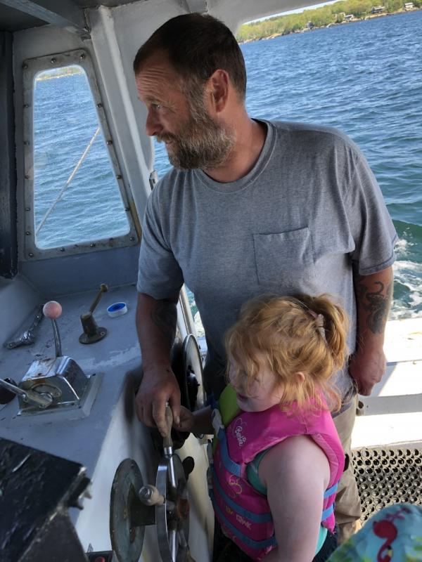 Chris and Dorothy on his boat, Ginger. Courtesy of Jessica Pinkham