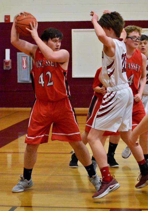 Kasey Mills grabs a rebound for the Wolverines. PHIL DI VECE/Wiscasset Newspaper