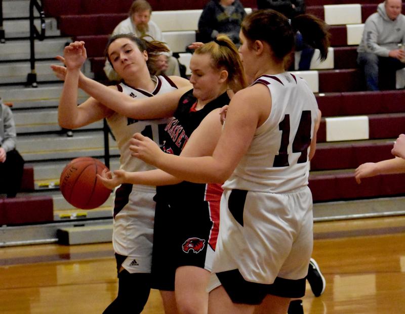 Madison Carrier is surrounded by Bobcat defenders. PHIL DI VECE/Wiscasset Newspaper