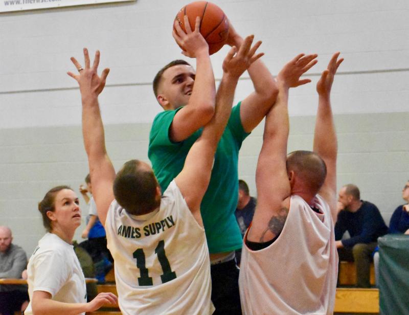 Ethan James with the ball helps lead Maxwell’s Market to a come from behind win over Ames Supply in the opening round of the Wiscasset Parks and Recreation adult basketball league’s tournament Feb. 23. PHIL DI VECE/Wiscasset Newspaper
