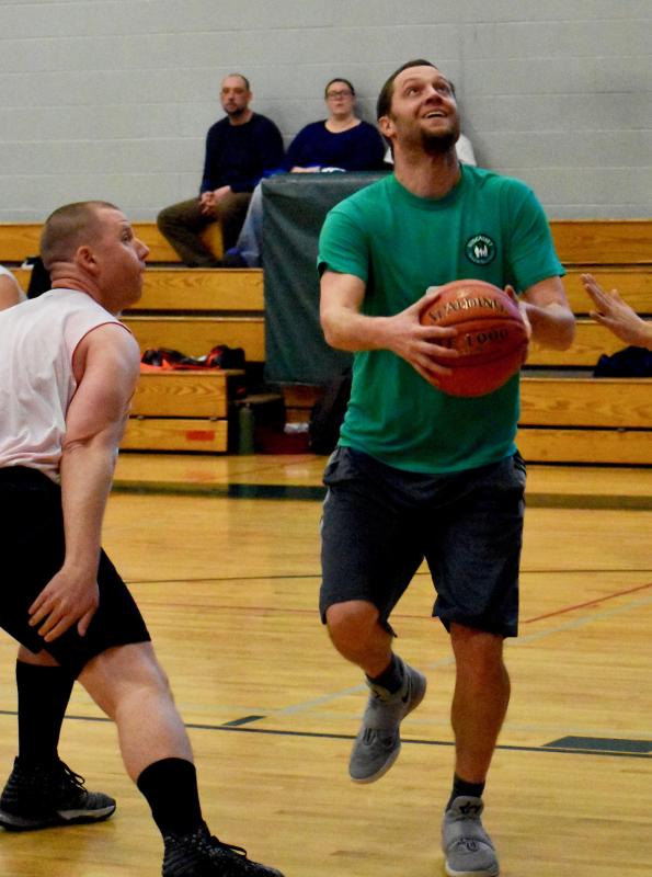 Matt Petrie, right, and Maxwell’s Market advanced to the tournament winner’s bracket following Sunday night’s win. PHIL DI VECE/Wiscasset Newspaper