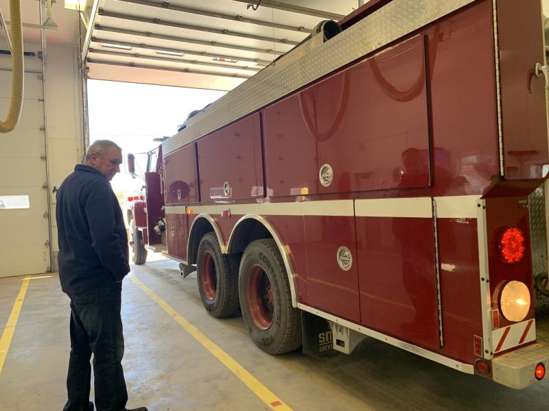 Newly re-elected Alna road commissioner Jeff Verney stands by as a fire truck backs back into the fire station bay where the annual town meeting was held Saturday. SUSAN JOHNS/Wiscasset Newspaper