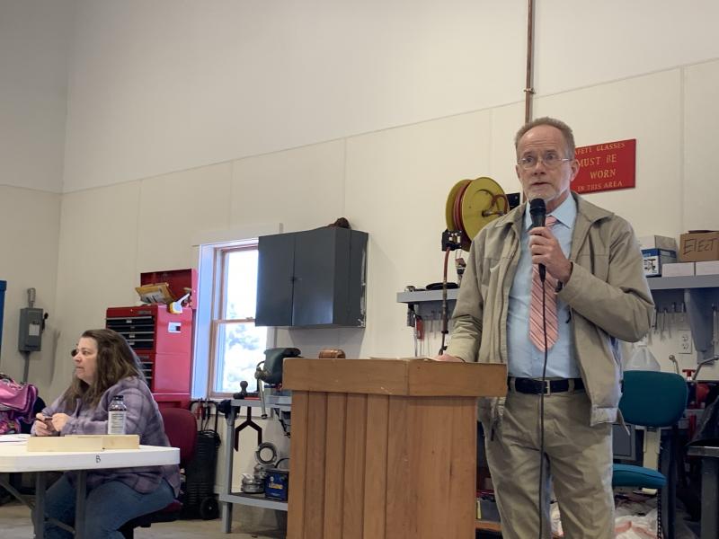Moderator Chris Cooper. At left, Town Clerk Liz Brown. They and others practiced social distancing of several feet from
one another during town meeting. SUSAN JOHNS/Wiscasset Newspaper