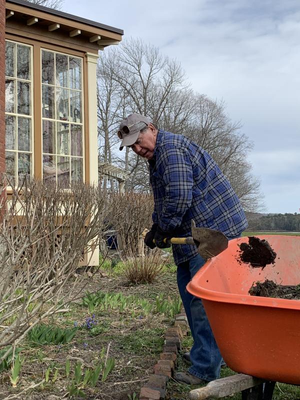 Ed Kavanagh works in his Federal Street yard April 8, a day before a snowscape returned to the Midcoast. SUSAN JOHNS/Wiscasset Newspaper