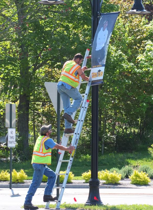Boothbay Public Works employees spent Wednesday morning placing graduation banners for the Boothbay Region High School Class of 2020 on Route 27. BILL PEARSON/Boothbay Register