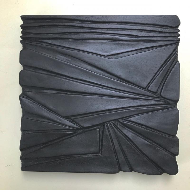“Number 6: one in a series of seven mahogany, carved relief wall sculptures, 11” x 11” x 1” in the sunlight, by Eben Blaney. Eben Blaney.