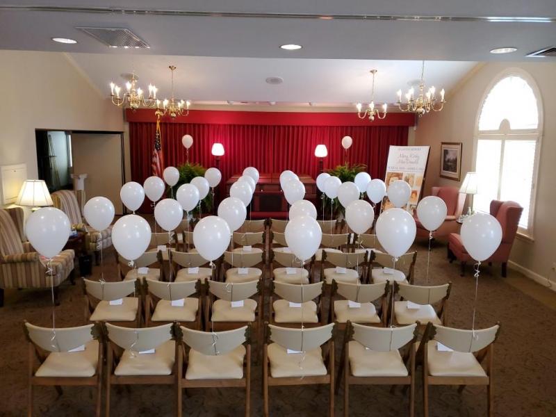 Balloons with notes in seats at Conroy-Tully Walker Funeral Homes in South Portland, Maine. Courtesy of Adam Walker