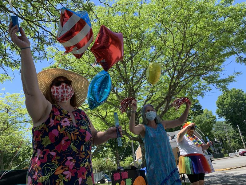 Fourth grade teachers Tamia Welch, left, and Becky Hallowell wave to a passing family in Wiscasset Elementary School’s reverse parade, summer sendoff June 19. SUSAN JOHNS/Wiscasset Newspaper