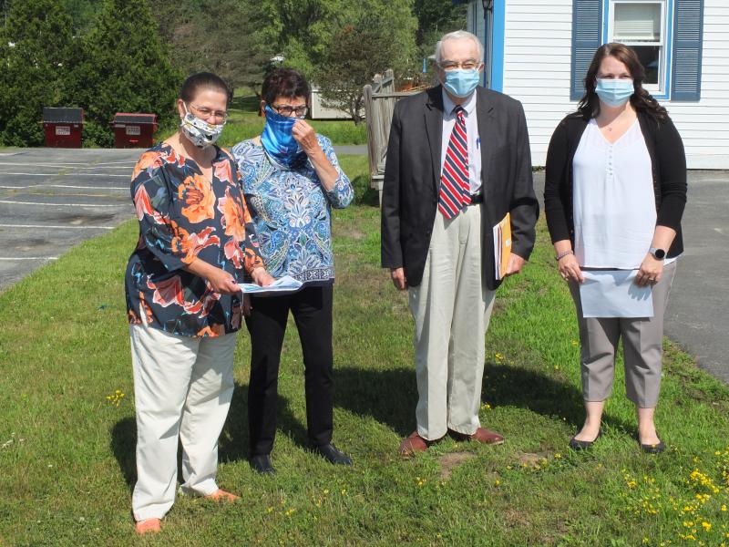County Administrator Carrie Kipfer, left, shows County Commissioners Mary Trescot, second from left, and Bill Blodgett, second from right, along with Assistant Administrator Denise Mills, the location of a proposed electronic sign at the Lincoln County Regional Planning Commission office following the July 7 meeting. BILL PEARSON/Boothbay Register