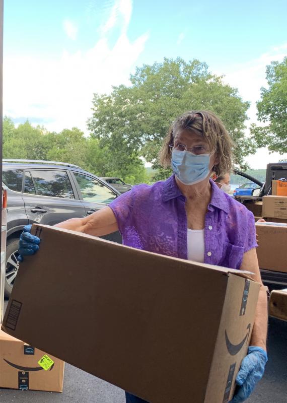 Sharman Ballantine helps get school supplies into Wiscasset Elementary School’s cafeteria Aug. 14 for sorting. SUSAN JOHNS/Wiscasset Newspaper