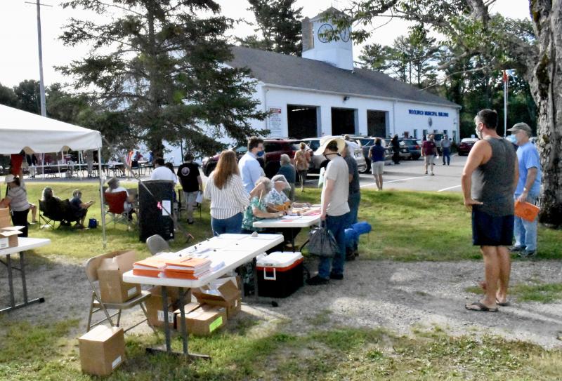 Voters arriving for town meeting were required to check in with ballot clerks. PHIL DI VECE/Wiscasset Newspaper