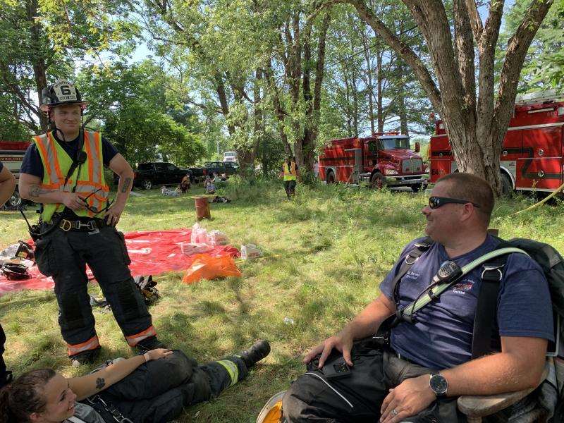 West Bath firefighter Ben Huebler, left, speaks with Woolwich Fire Chief Michael Demers. SUSAN JOHNS/Wiscasset Newspaper