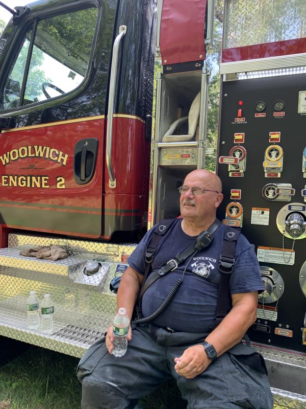 Woolwich Fire Department Safety Officer Larry Albert cools off. SUSAN JOHNS/Wiscasset Newspaper