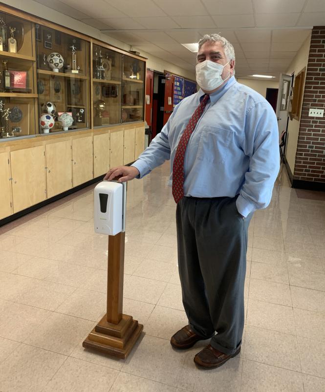 WMHS Principal Charles Lomonte with a hand sanitizer in the lobby. SUSAN JOHNS/Wiscasset Newspaper