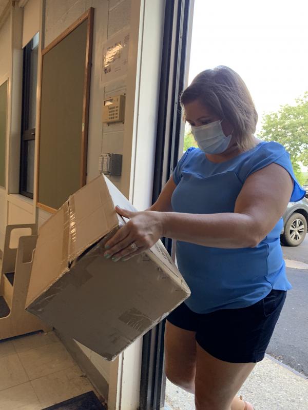 WES Assistant Principal Laura Mewa pitches in. SUSAN JOHNS/Wiscasset Newspaper