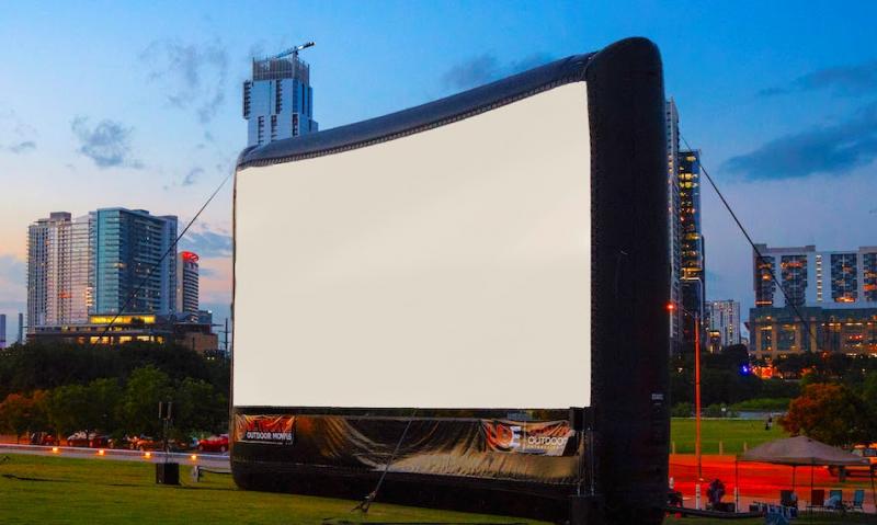 A 17-foot x 30-foot pop-up screen with enhanced sound for outdoor film viewing! Courtesy of Helen Meserve